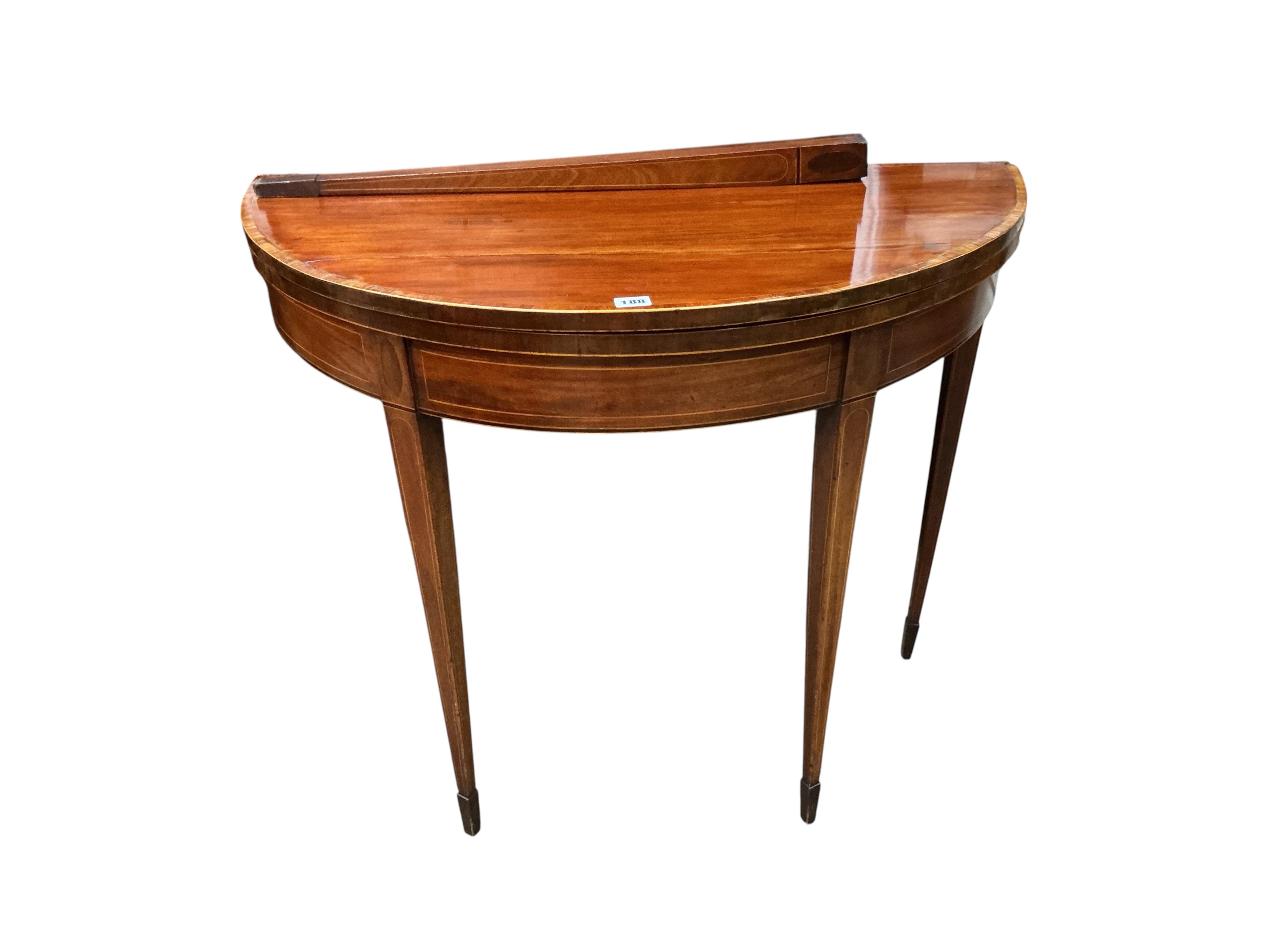 A George III tulip banded mahogany demi lune folding card table (a.f.), width 91cm, depth 45cm, height 74cm